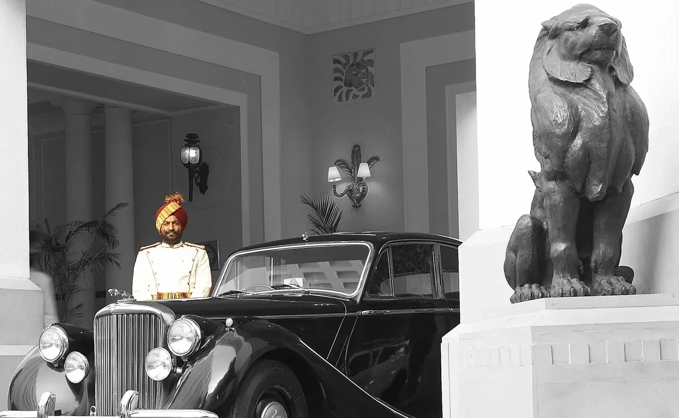Heritage palace arrival with vintage car in Rajasthan