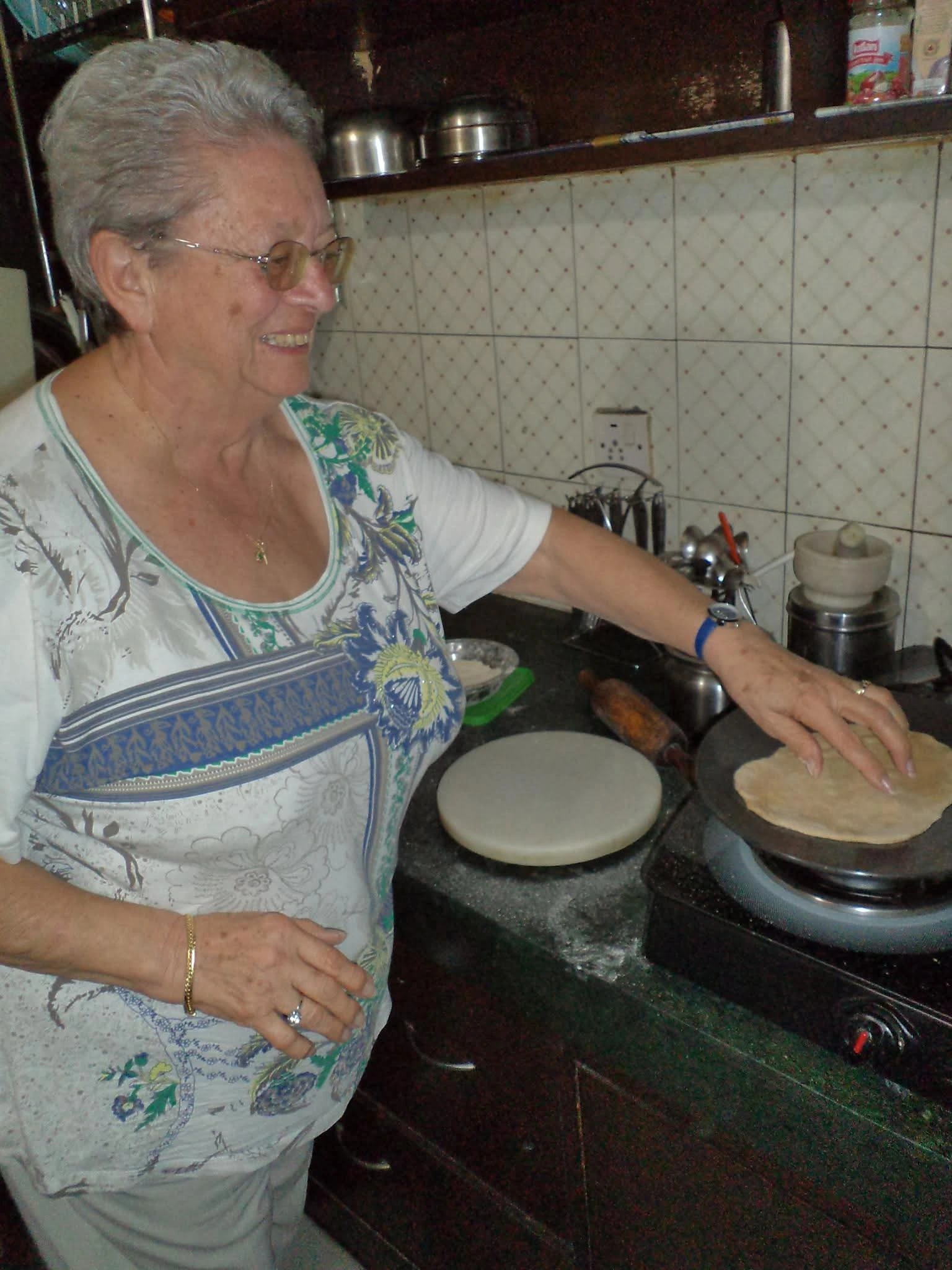 A guest preparing food during a home-style experience