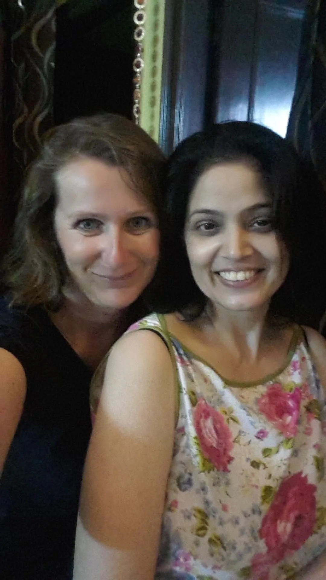Neelima sharing a candid photograph with a guest during an India journey
