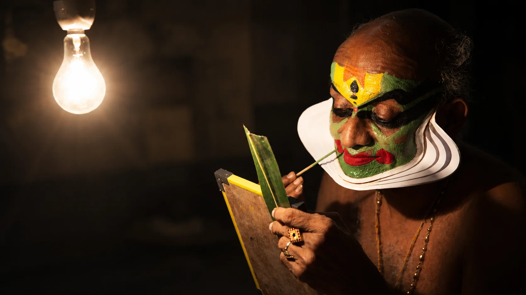 Kathakali artist preparing for a Kerala performance